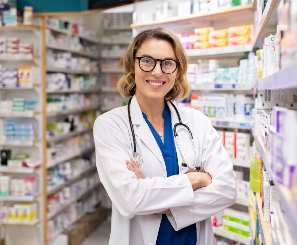 Happy smiling pharmacist in drugstore Happy smiling pharmacist in drugstore